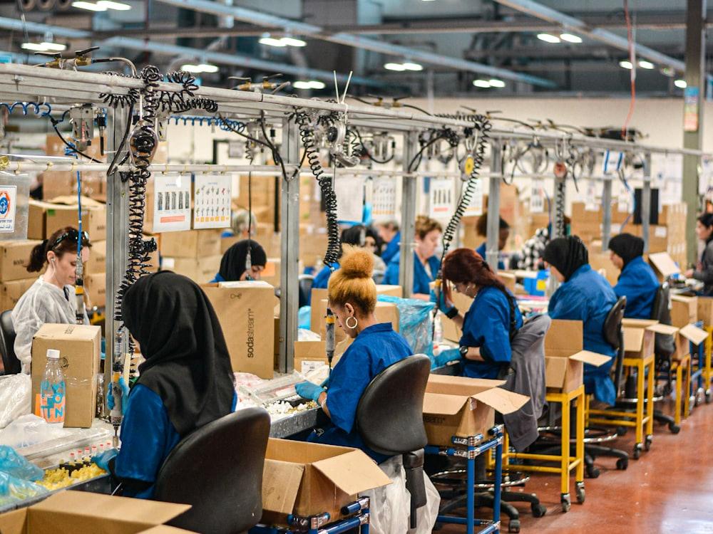Workers at their stations on a manufacturing floor